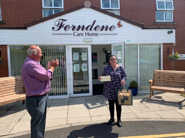 Dawn Shelton receiving her gift at the front of Ferndale Care Home